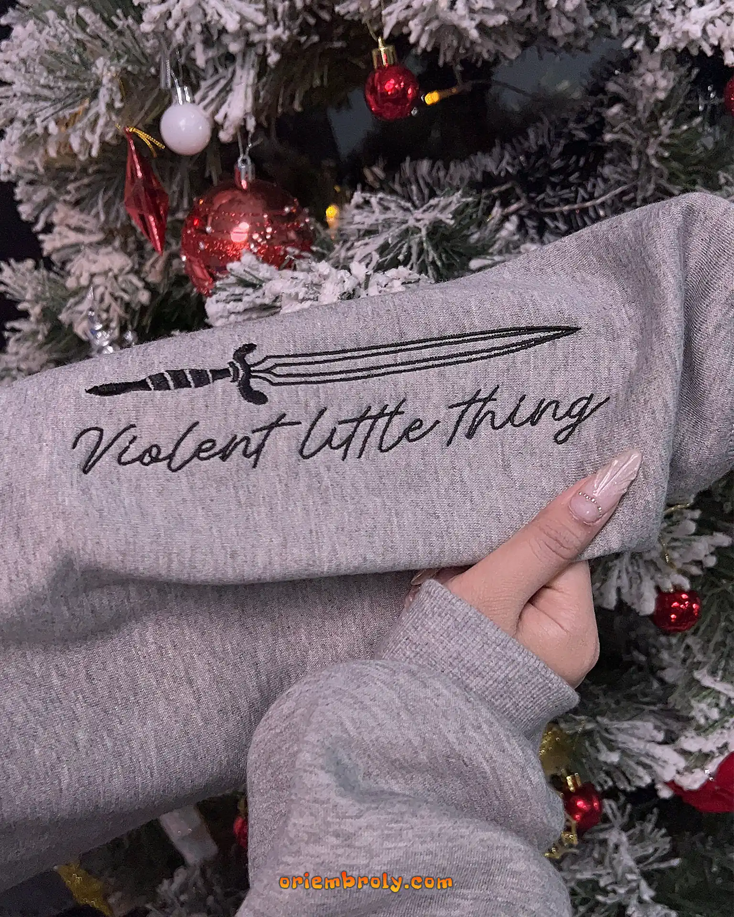 Violent Little Thing quote embroidered on left sleeve