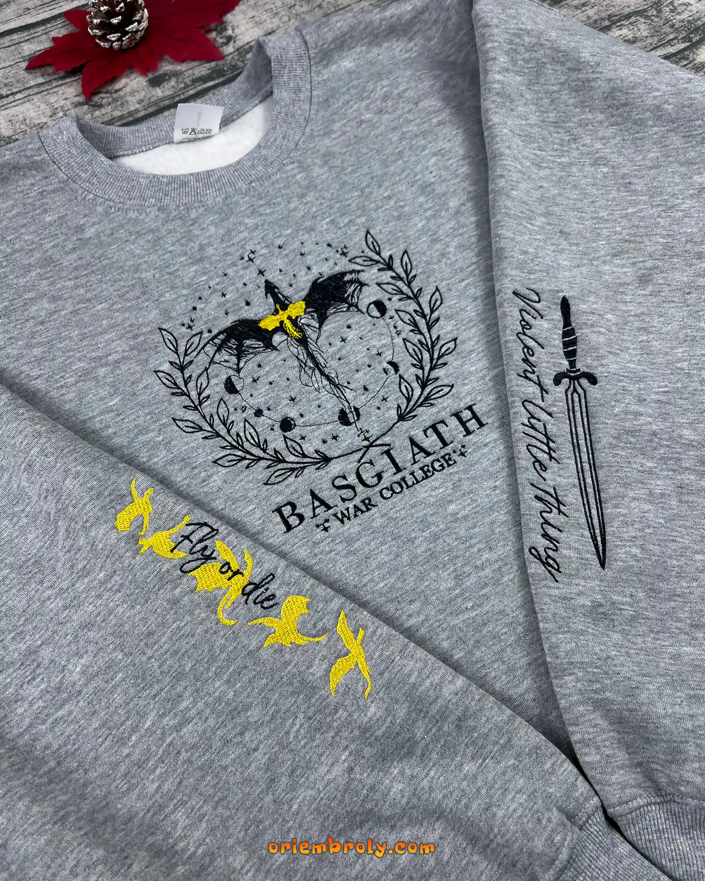 Winged sword embroidery on Basgiath War College sweatshirt