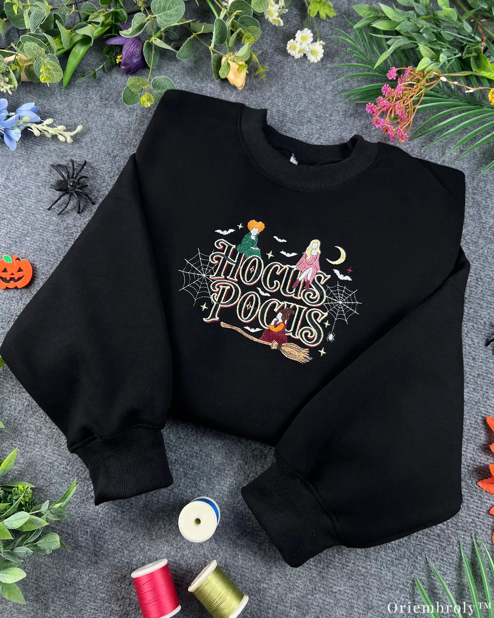 Black Halloween crewneck sweatshirt embroidered with Hocus Pocus text, Sanderson sisters, and colorful sewing threads