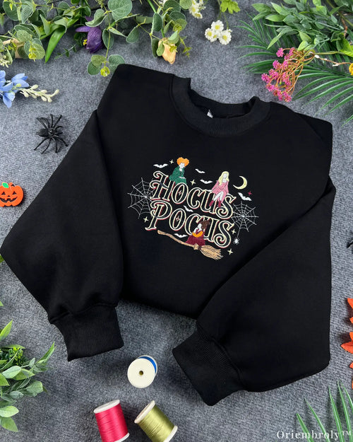 Black Halloween crewneck sweatshirt embroidered with Hocus Pocus text, Sanderson sisters, and colorful sewing threads
