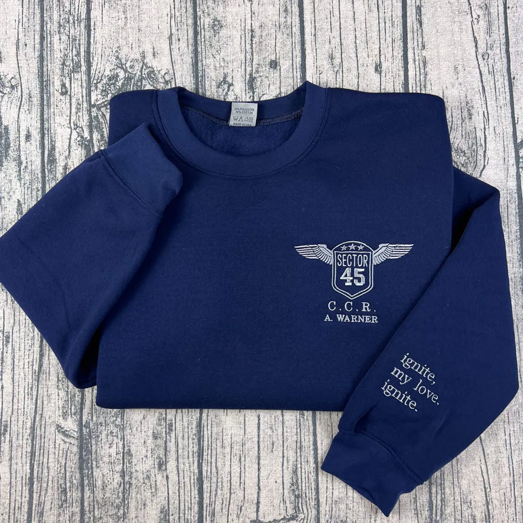 A Warner sweatshirt inspired by the Shatter Me series, custom embroidery for book lover apparel fans.