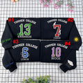 Boys of Tommen embroidered sweatshirt featuring Johnny Kavanagh and Binding 13 book merch for fans of bookish fashion.
