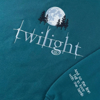 Teal t-shirt with 'Twilight' design featuring a moon and trees on a dark blue background.