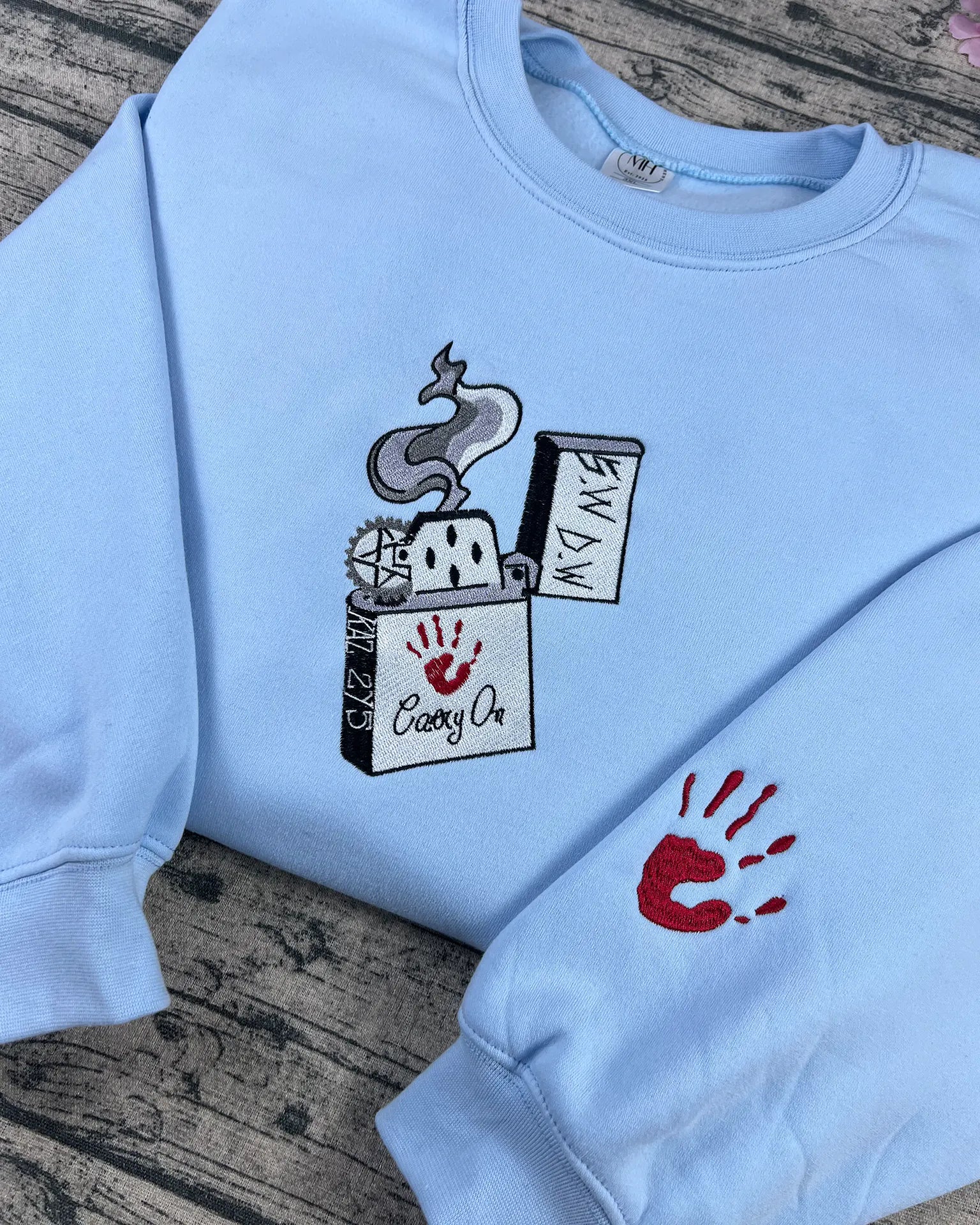 Embroidered fan-inspired Supernatural hoodie with red handprint