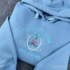 Soft girl coquette aesthetic blue hoodie with an embroidered princess castle topped with a light blue bow. Blends trendy bows with nostalgic Disney magic for a stylish, feminine look