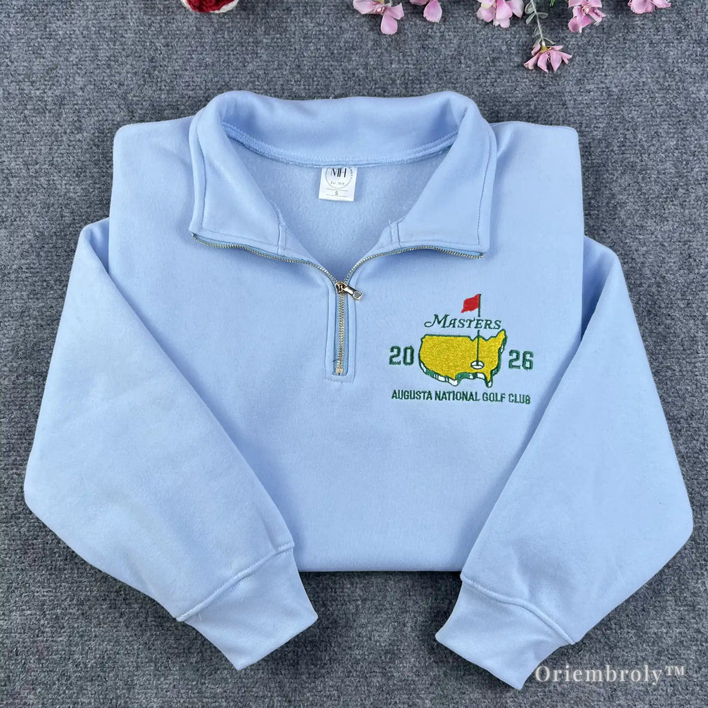 Pink coquette aesthetic quarter-zip pullover with a classic Masters golf logo. Blends feminine soft girl style with traditional country club fashion for a trendy, preppy look