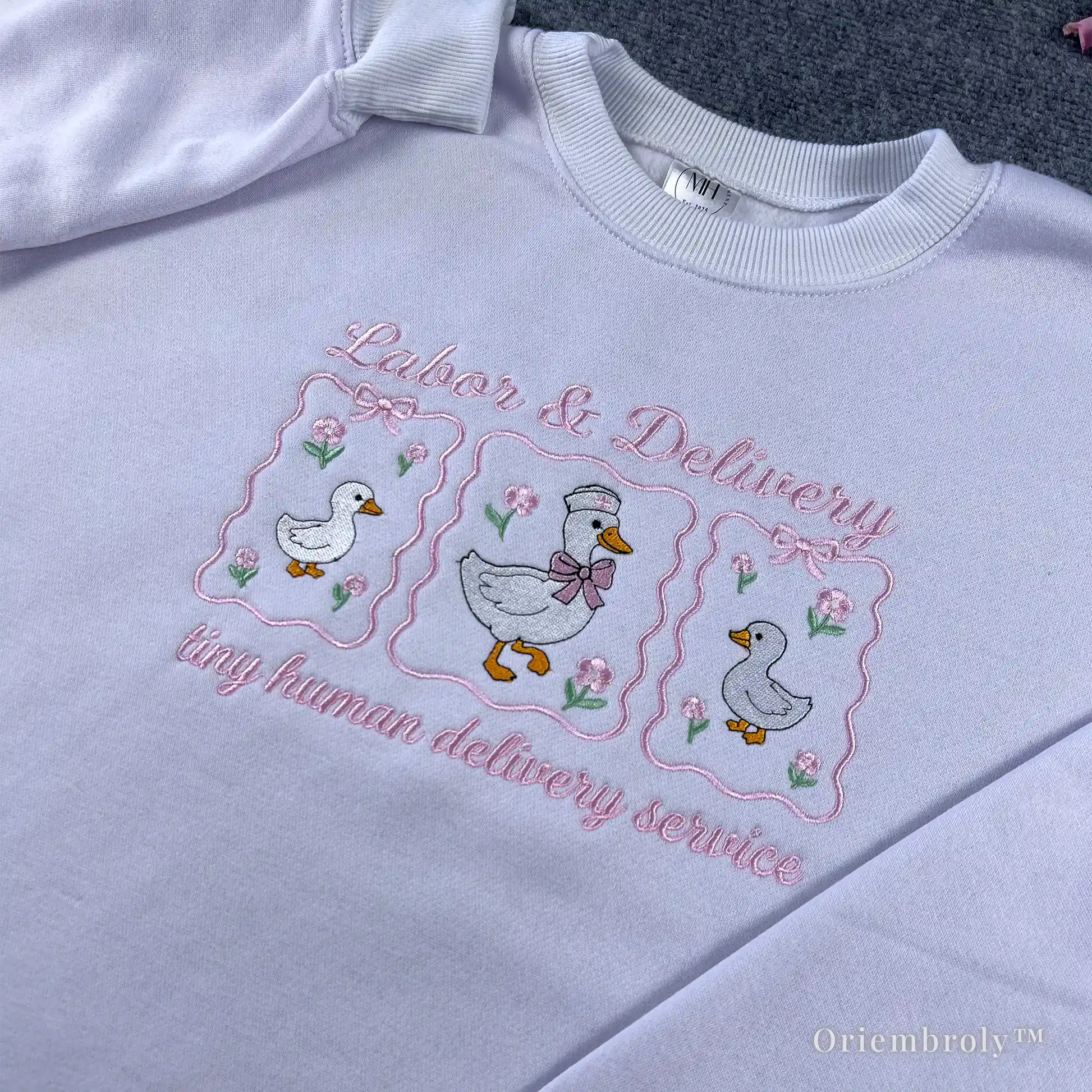 Aesthetic coquette nurse crewneck featuring pink ribbons and embroidered geese