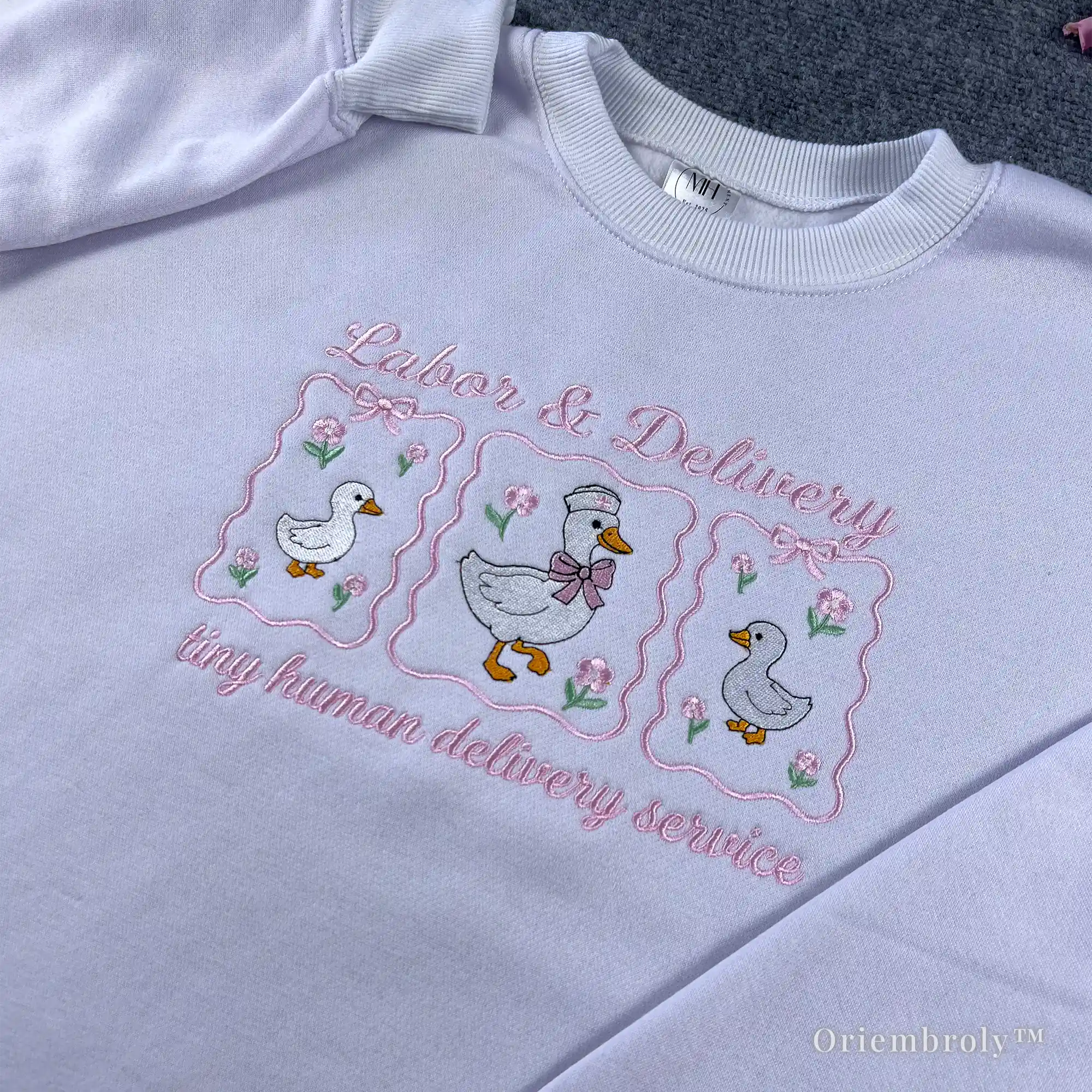Aesthetic coquette nurse crewneck featuring pink ribbons and embroidered geese