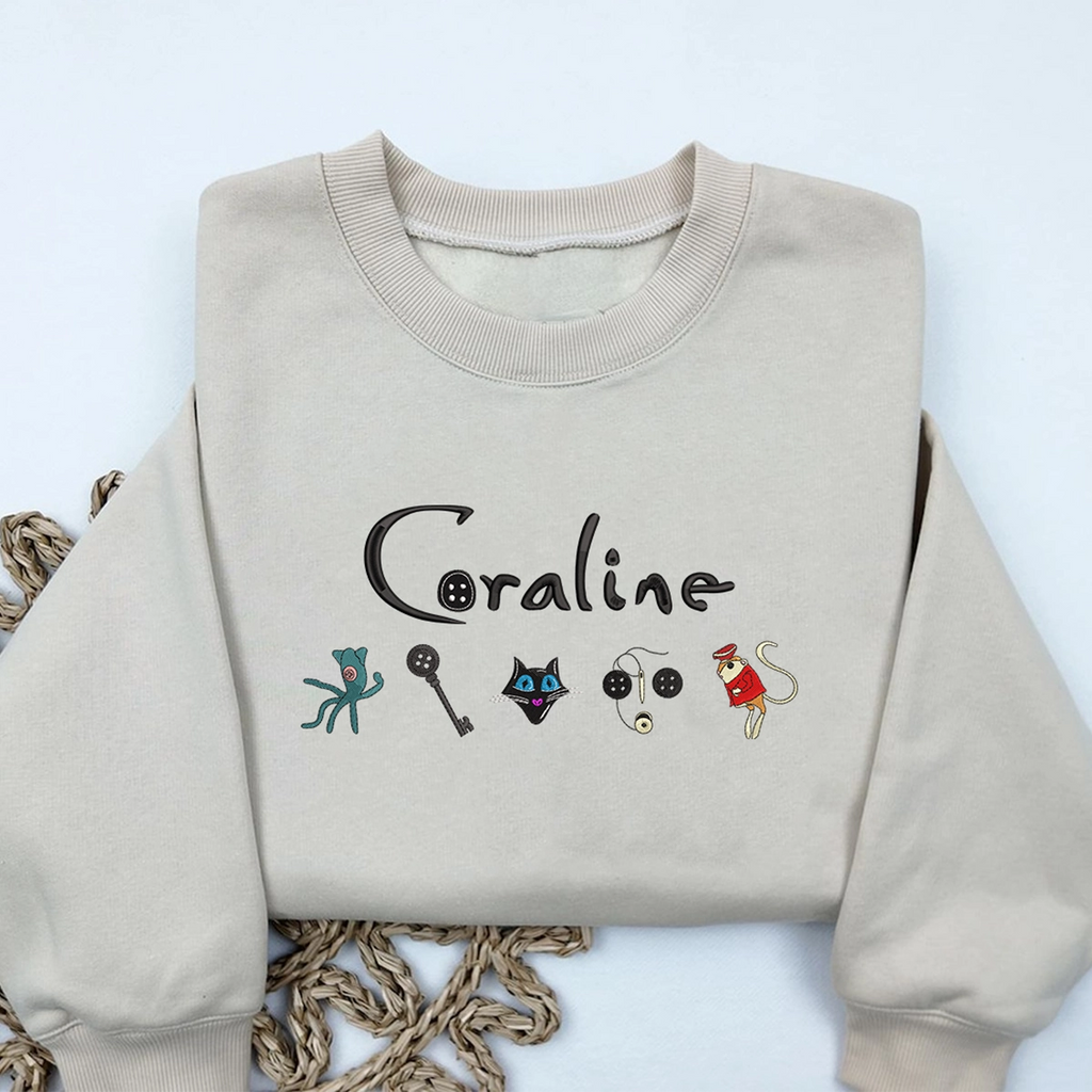 Coraline embroidered Halloween sweatshirt with scary doll design
