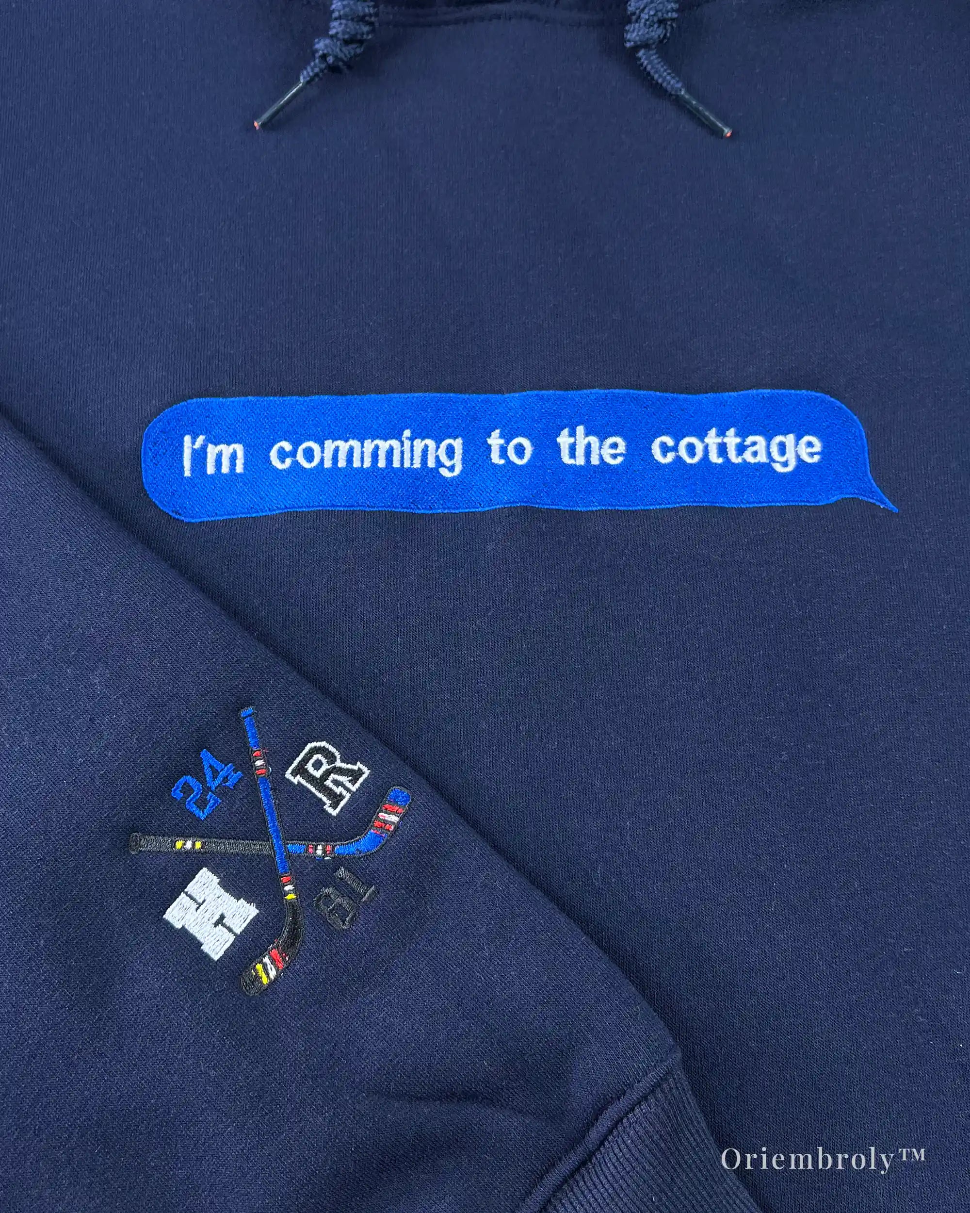 Close-up of cottage hockey romance embroidery detail