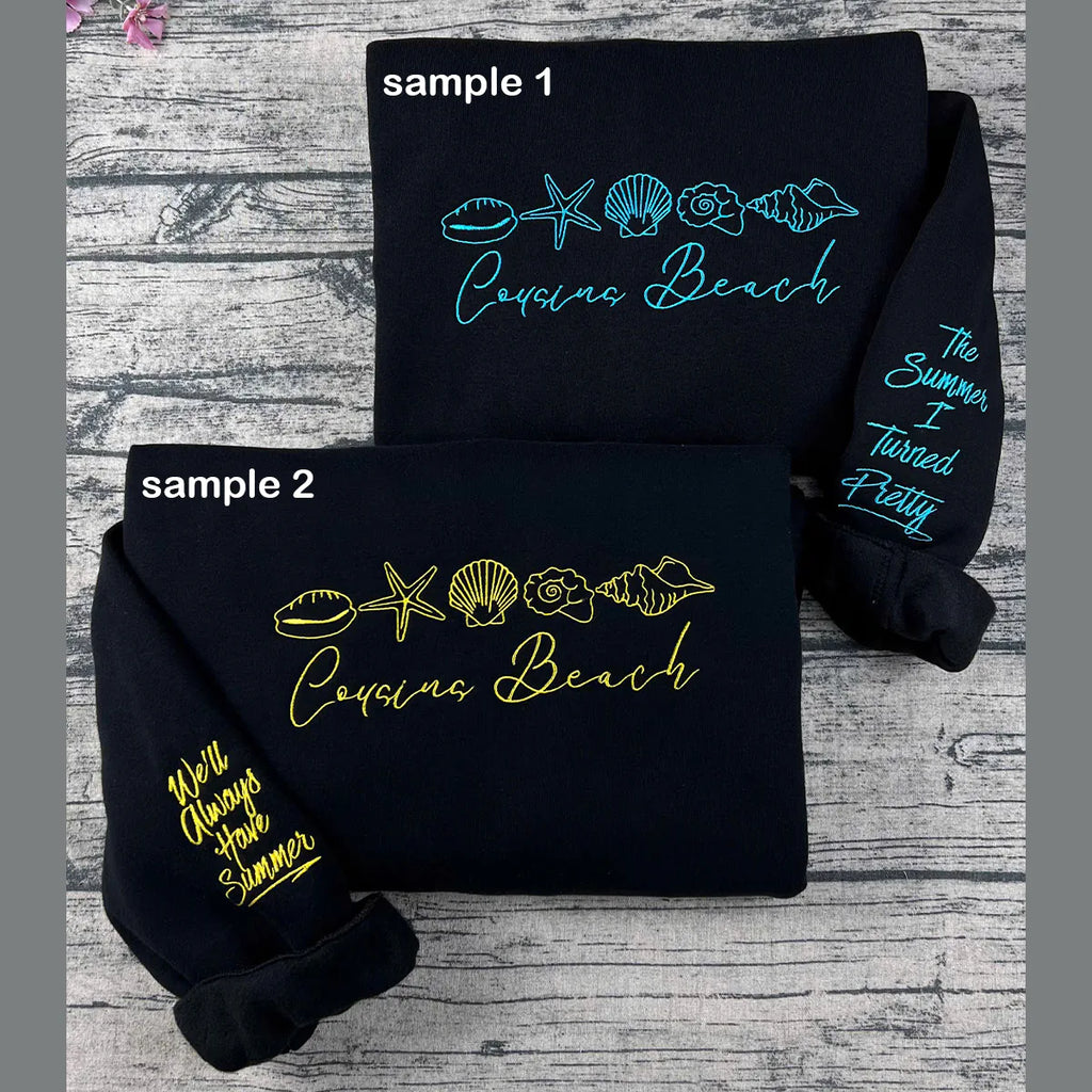 Cousins Beach embroidered sweatshirt displayed on hanger