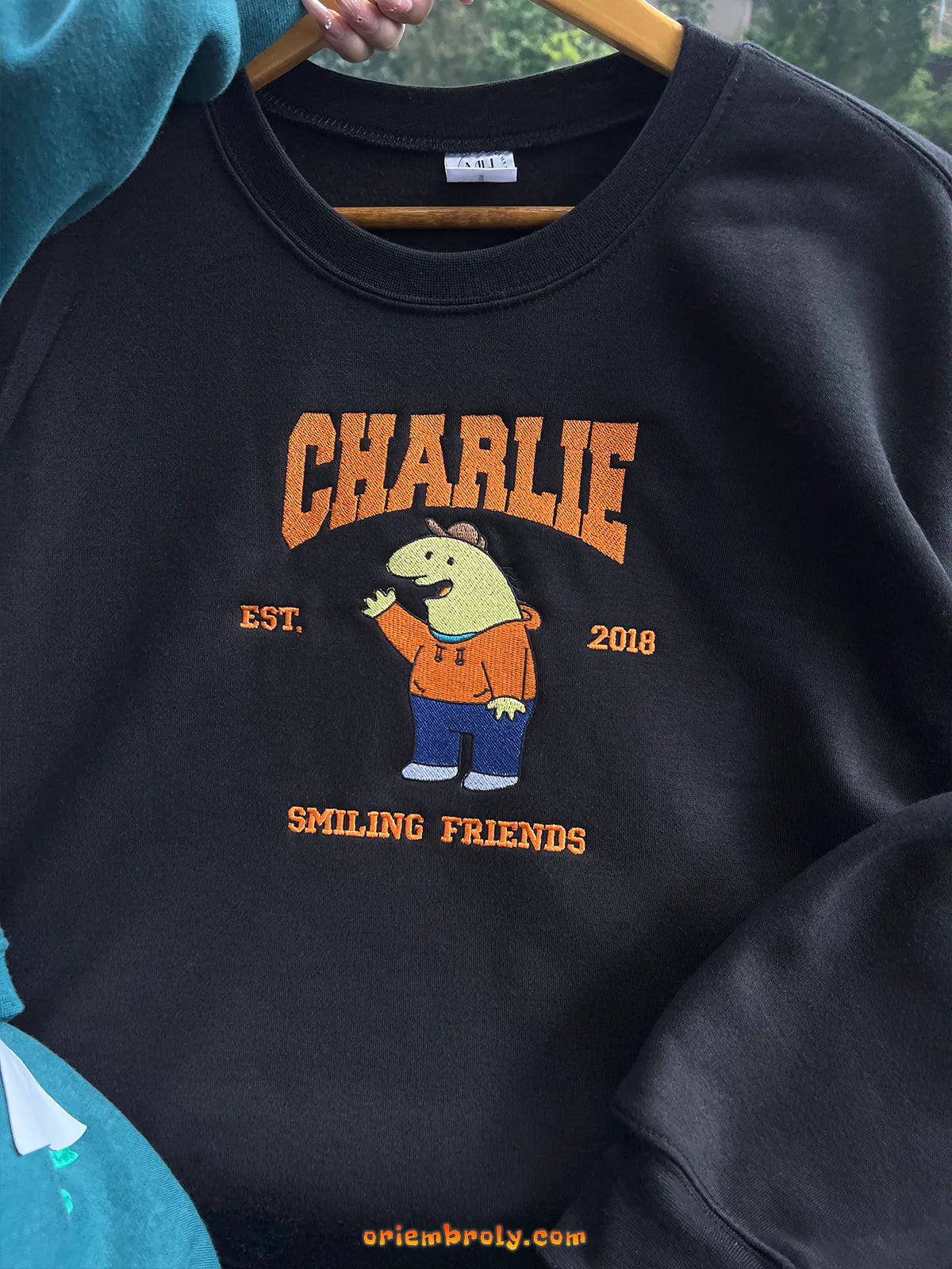 Smiling character embroidered sweatshirt for casual wear