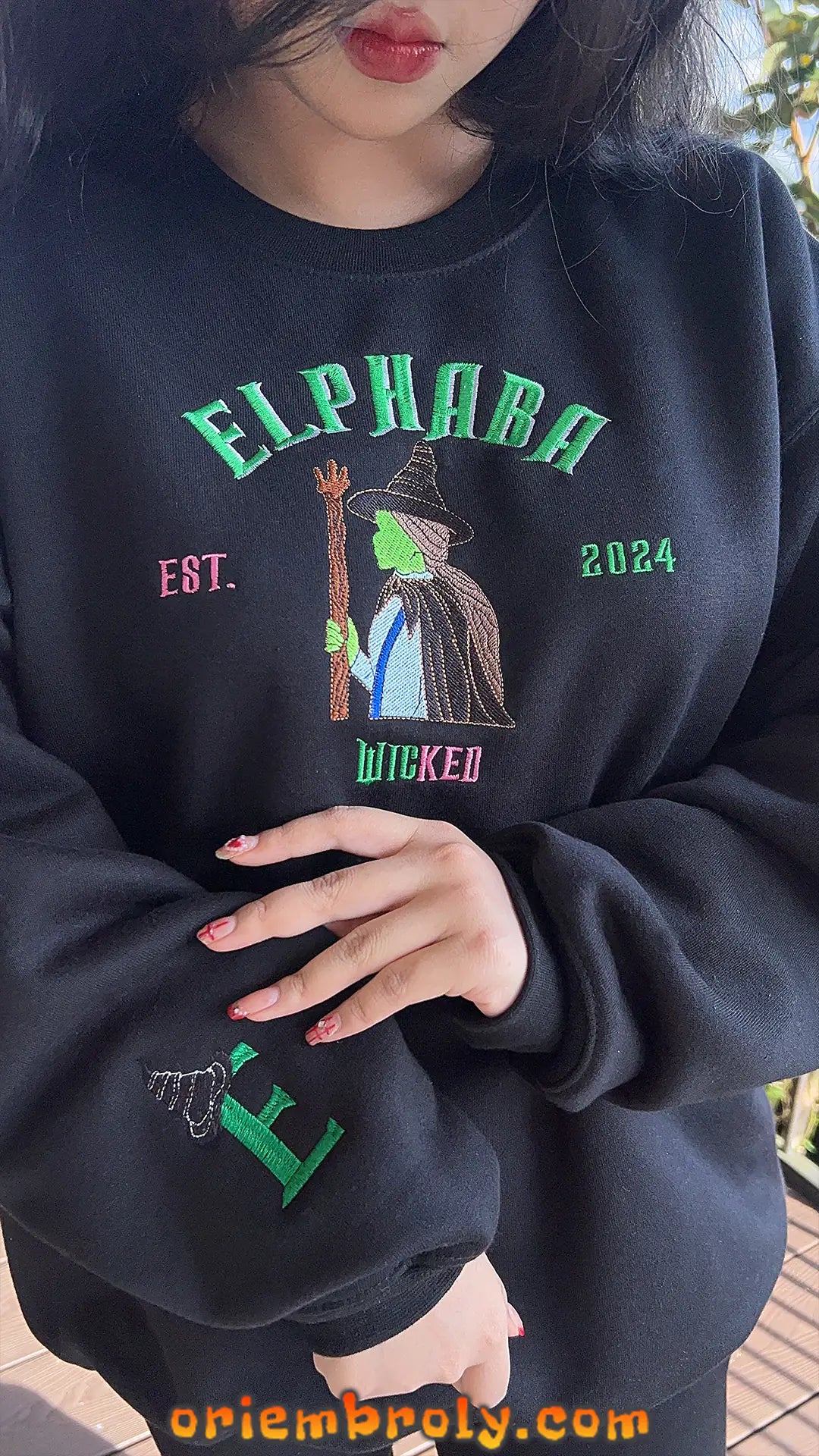 Close-up of witch embroidery stitching on sweatshirt