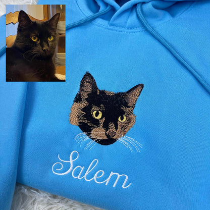 Personalized embroidered cat portrait sweatshirt featuring a custom feline design.