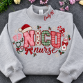 Flat lay of a sport grey crewneck sweatshirt embroidered with Christmas NICU nurse applique letters, santa hat, baby footprints, and custom collar name