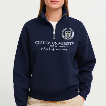 Close-up of embroidered college name on quarter zip sweatshirt