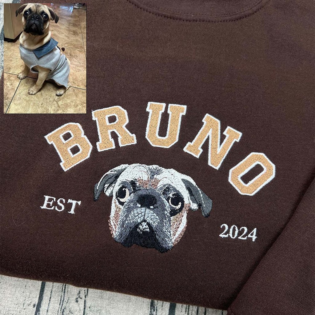 Custom embroidered hoodie featuring a pet’s paw print design.