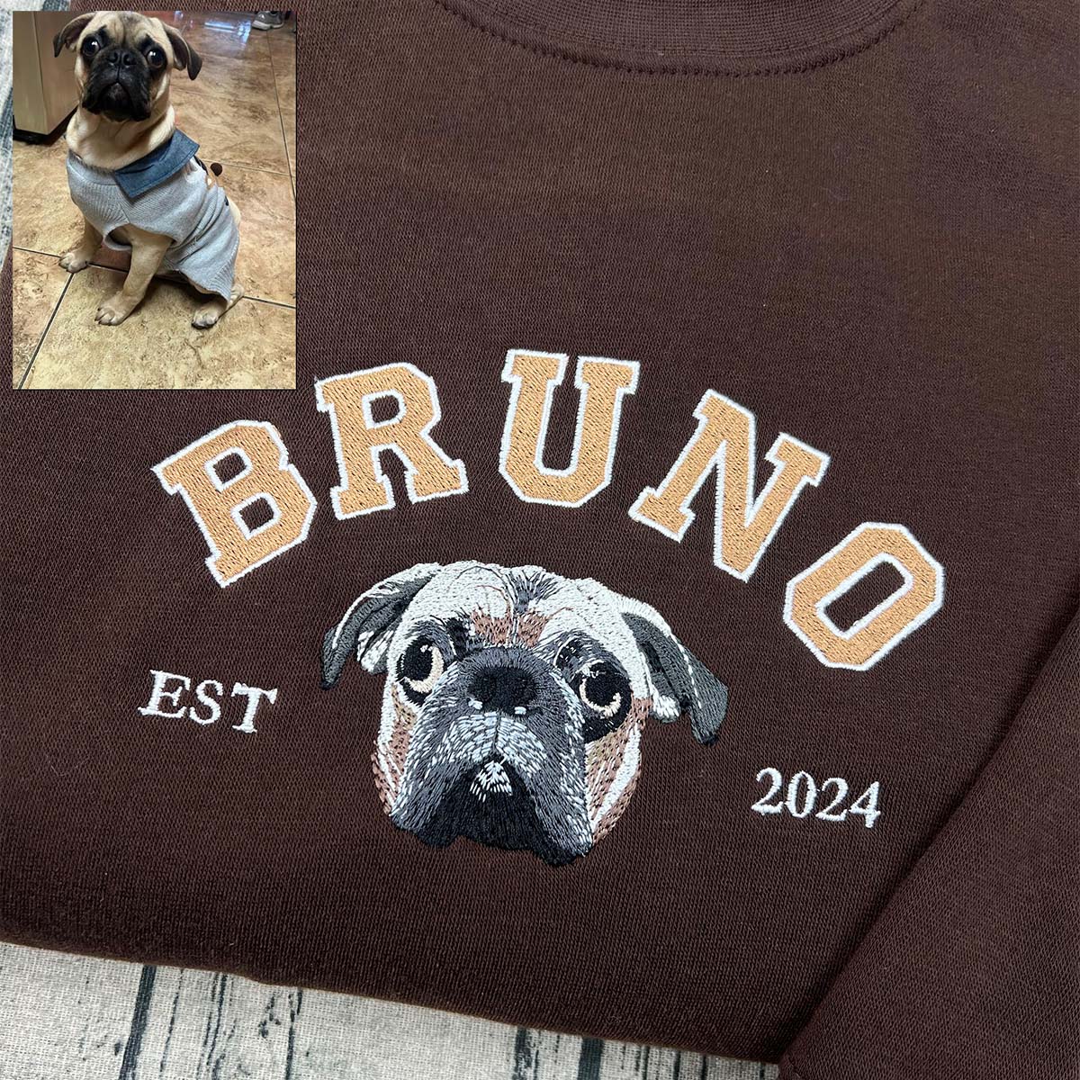 Custom embroidered hoodie featuring a pet’s paw print design.