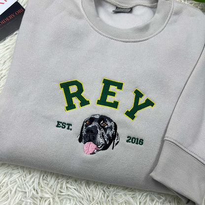 Personalized pet memorial sweatshirt with embroidered dog or cat portrait.