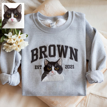 Custom embroidered sweatshirt featuring a personalized pet face and name, perfect gift for pet lovers.