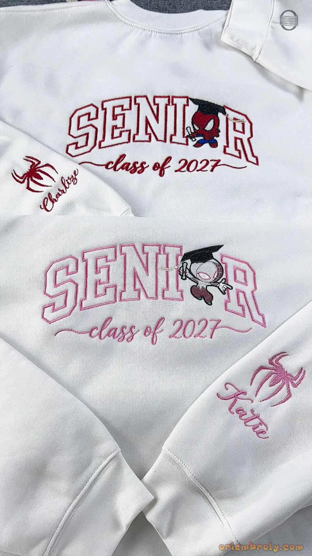 Two white custom Senior Class of 2027 embroidered sweatshirts displayed together with red and pink thread variations.
