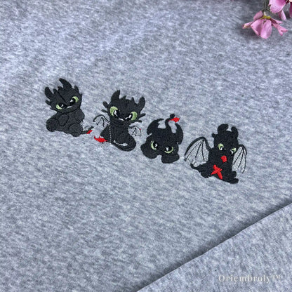 close up embroidery of cute night fury dragon with green eyes