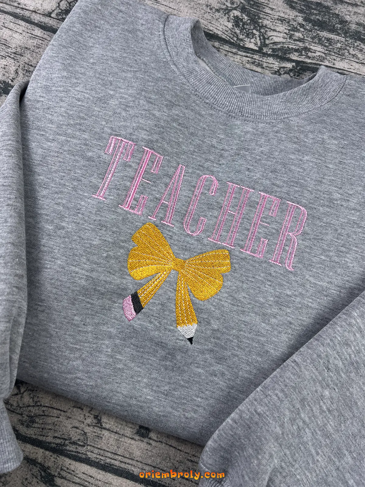 Grey teacher crewneck with pink embroidery