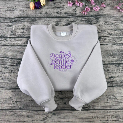 literary quote embroidered sweatshirt worn casually