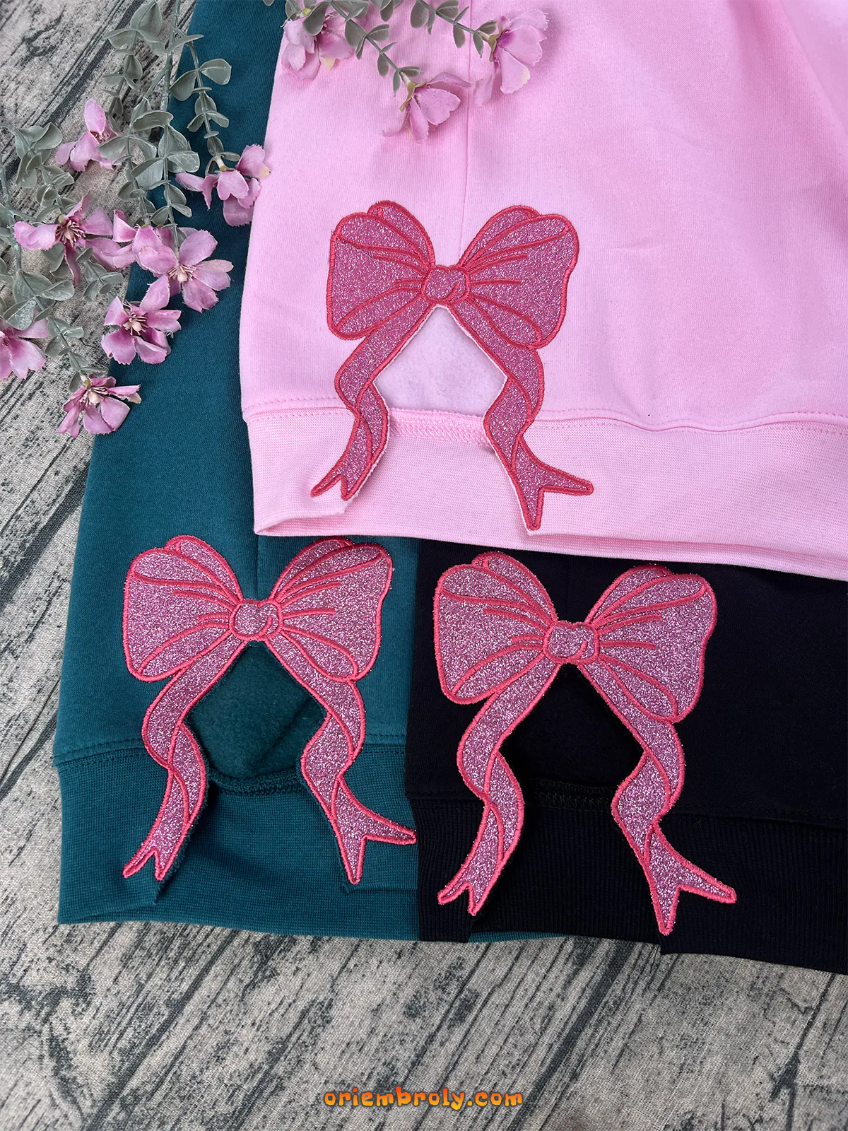 Defy Gravity Wicked embroidered hoodie with side bow glitter detail