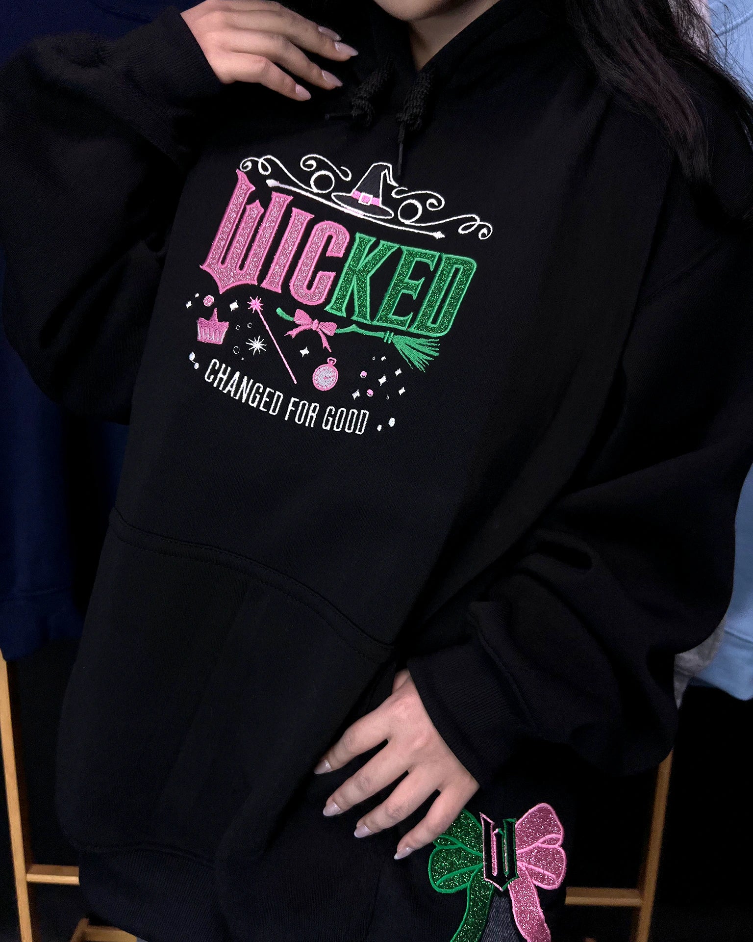 Defy Gravity Wicked embroidered sweatshirt hoodie, inspired by Wizard of Oz. Unique fan gift sweater for musical lovers and theater fans.
