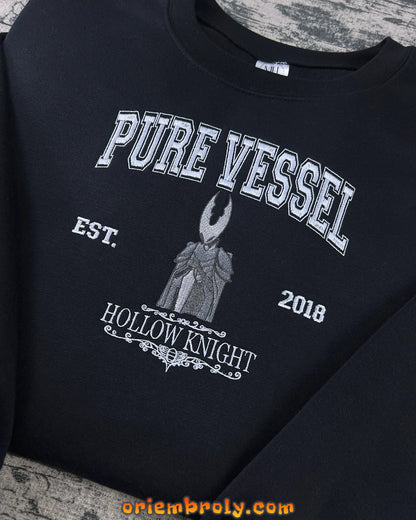 Close-up of textured embroidery on Pure Vessel sweatshirt