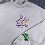 Disney Tangled see the light sweater with cute Pascal embroidery detail for fans.