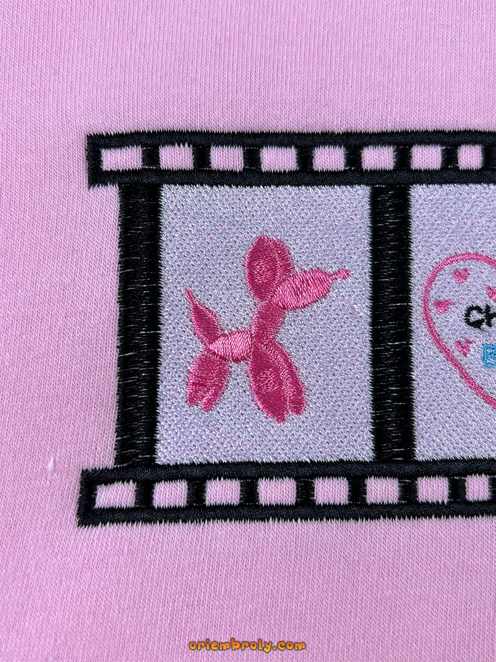 Gossip Girl film strip graphic embroidered top