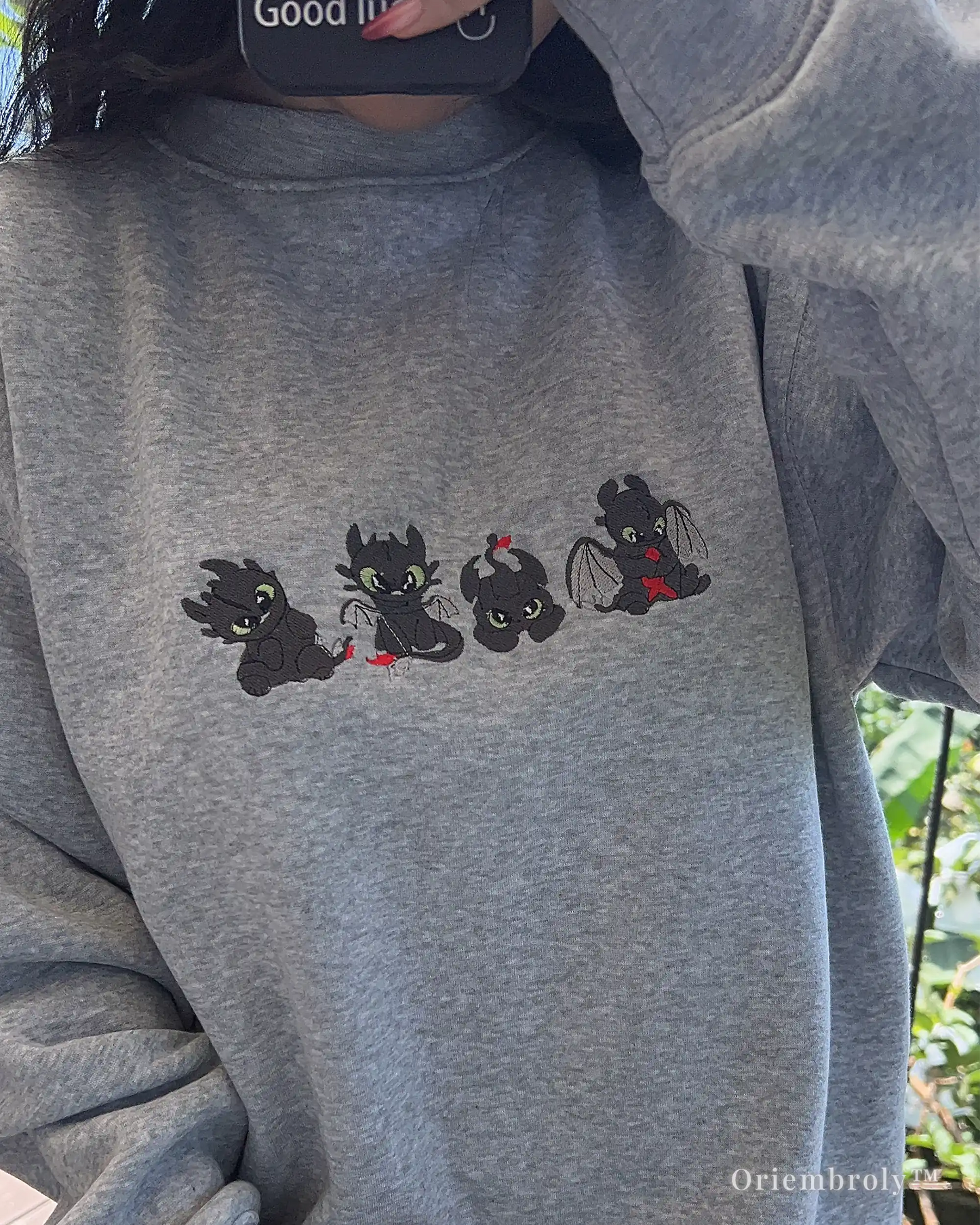 fantasy dragon embroidered sweatshirt worn casually