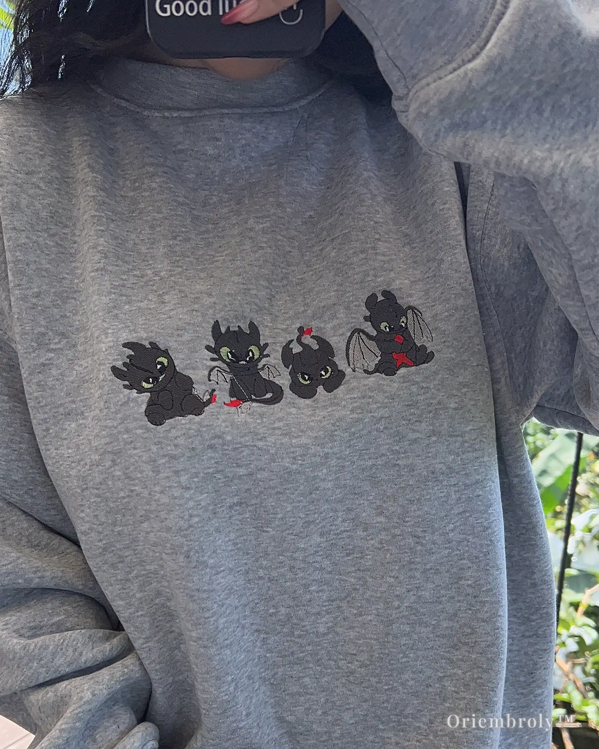 fantasy dragon embroidered sweatshirt worn casually