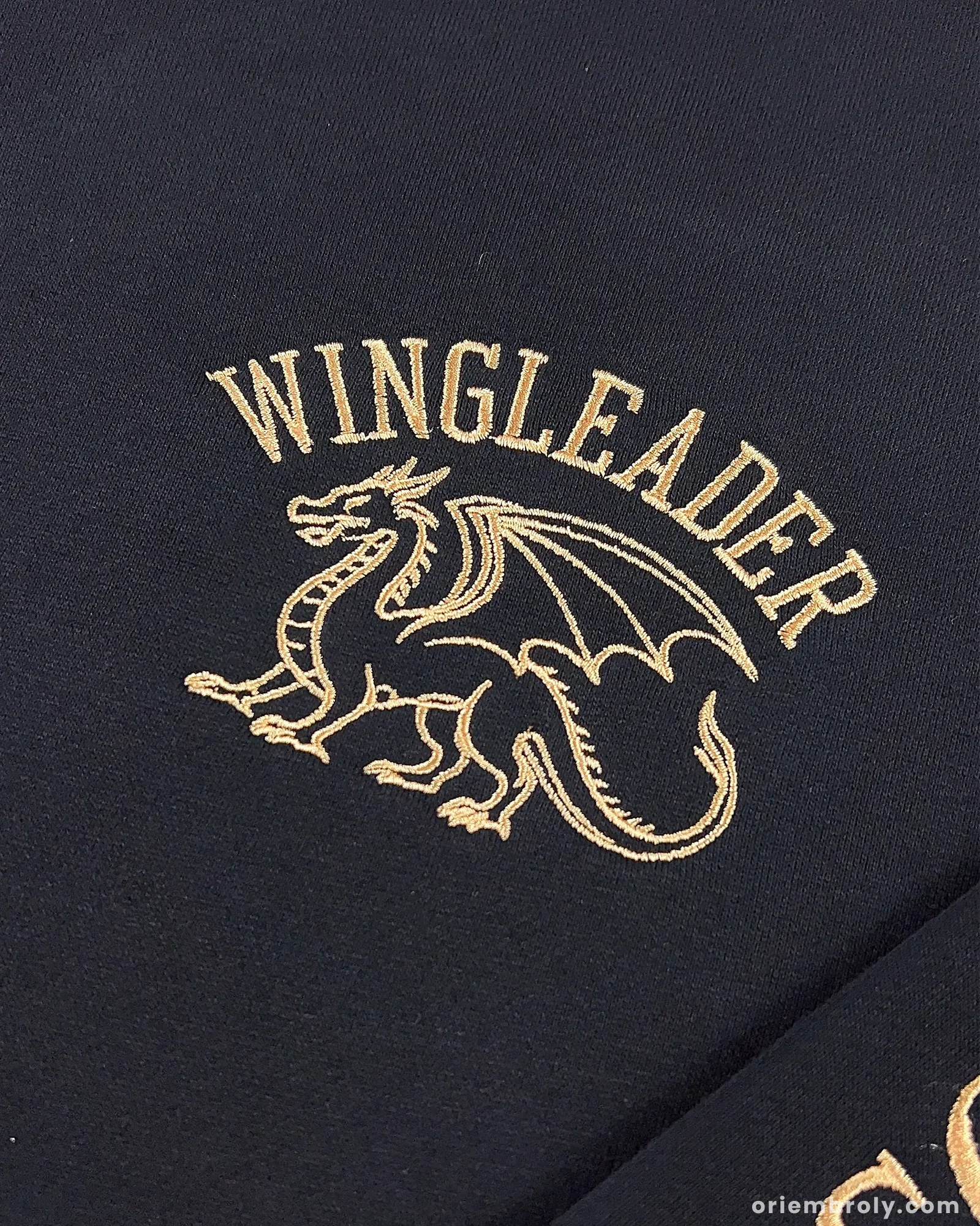 Black dragon rider embroidered quarter zip sweatshirt design detail