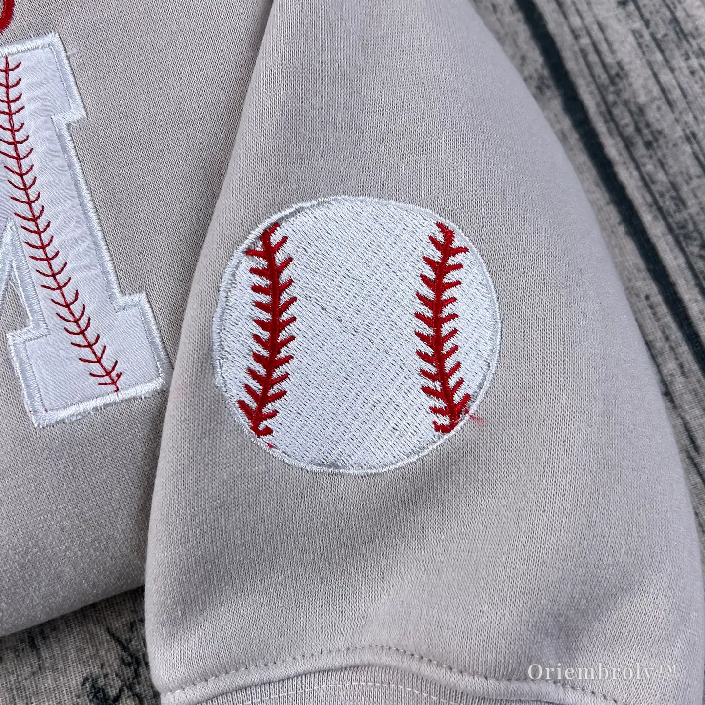 embroidered baseball icon on sleeve detail