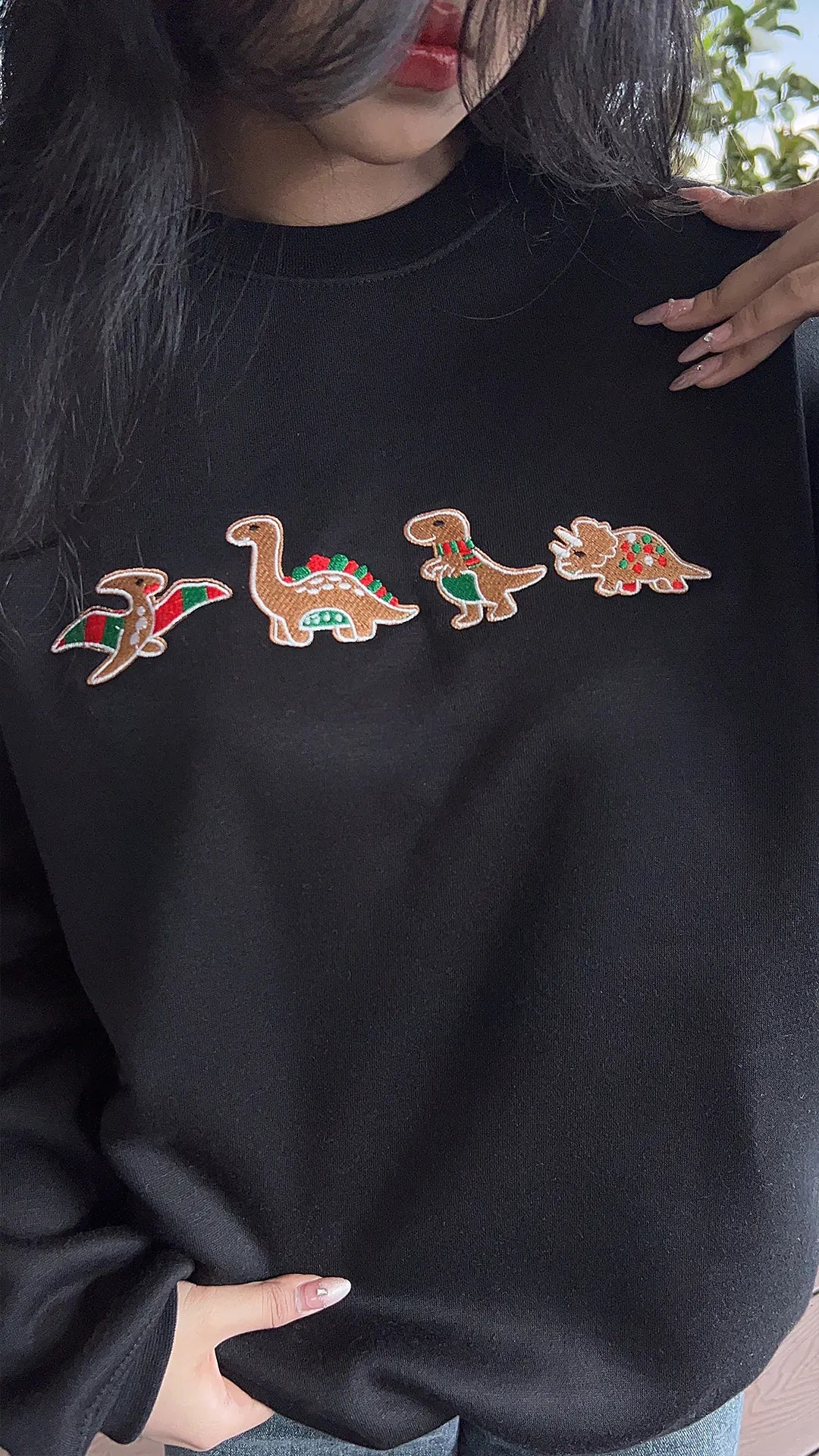 Fun Christmas sweatshirt featuring a playful dinosaur design