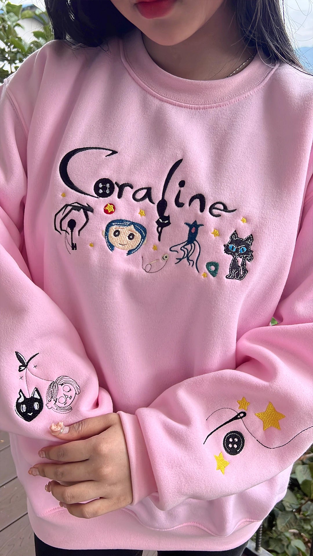 Cartoon character hoodie with embroidered scary doll Halloween design