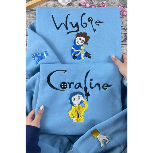 Matching Halloween hoodies featuring Coraline and Wybie embroidery