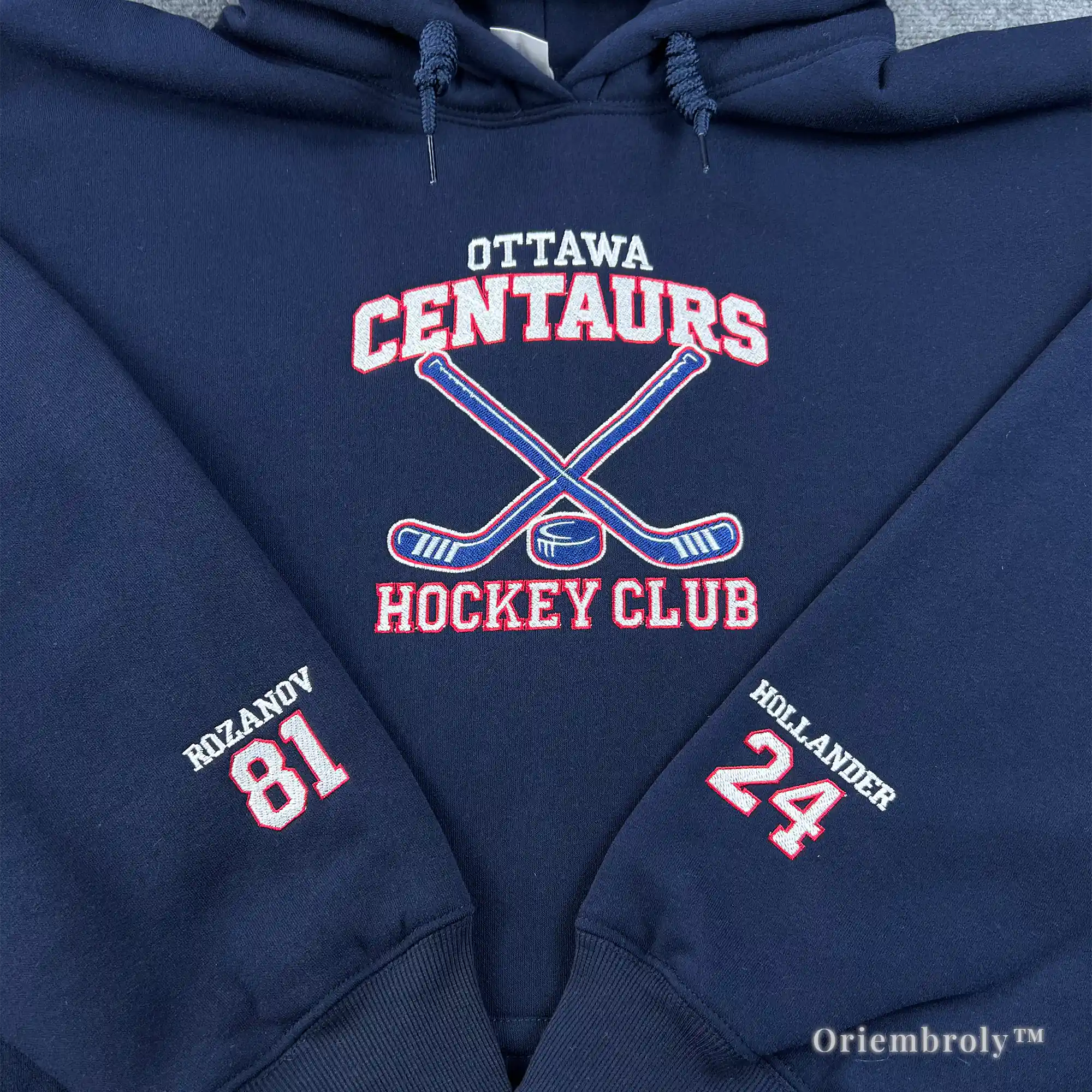 embroidered hockey hoodie with sticks and puck design