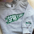 Custom embroidered sweatshirt with team name pennant design