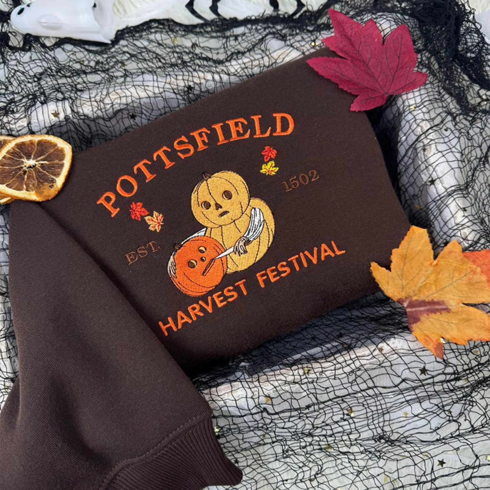 Embroidered Pottsfield Harvest Festival sweatshirt featuring a trendy cartoon design. Perfect for fall, autumn, and spooky season fans.