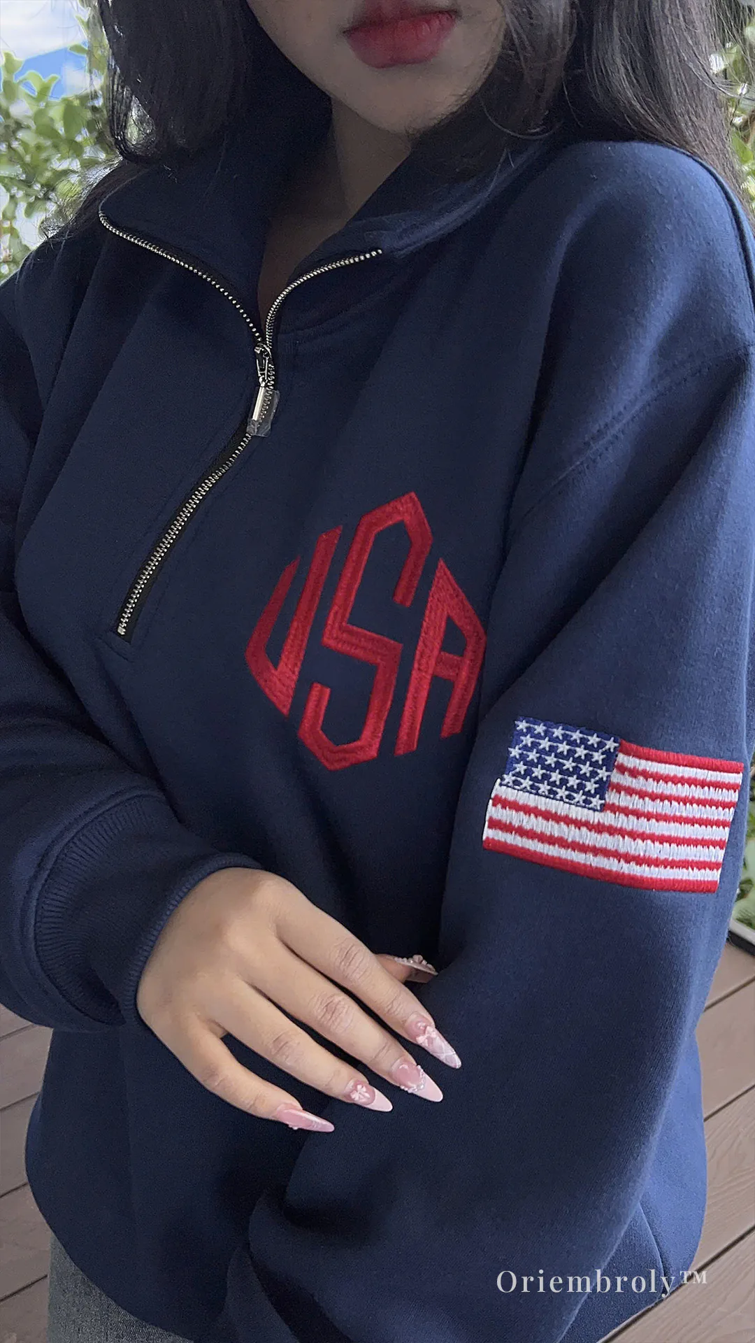 unisex embroidered quarter zip sweatshirt worn casually