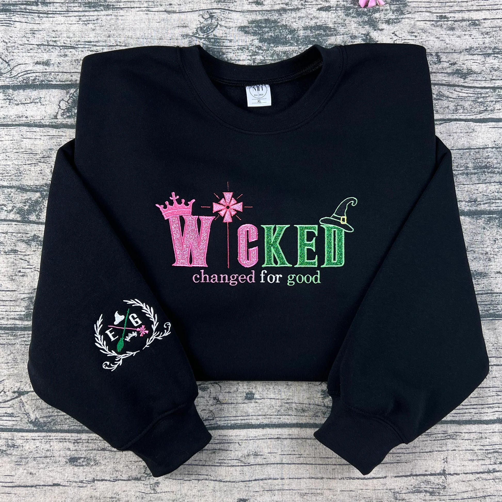 Embroidered Wicked sweatshirt featuring Defying Gravity inspired design