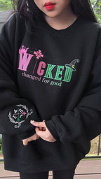 Embroidered Wicked sweatshirt with Elphaba and Glinda inspired design