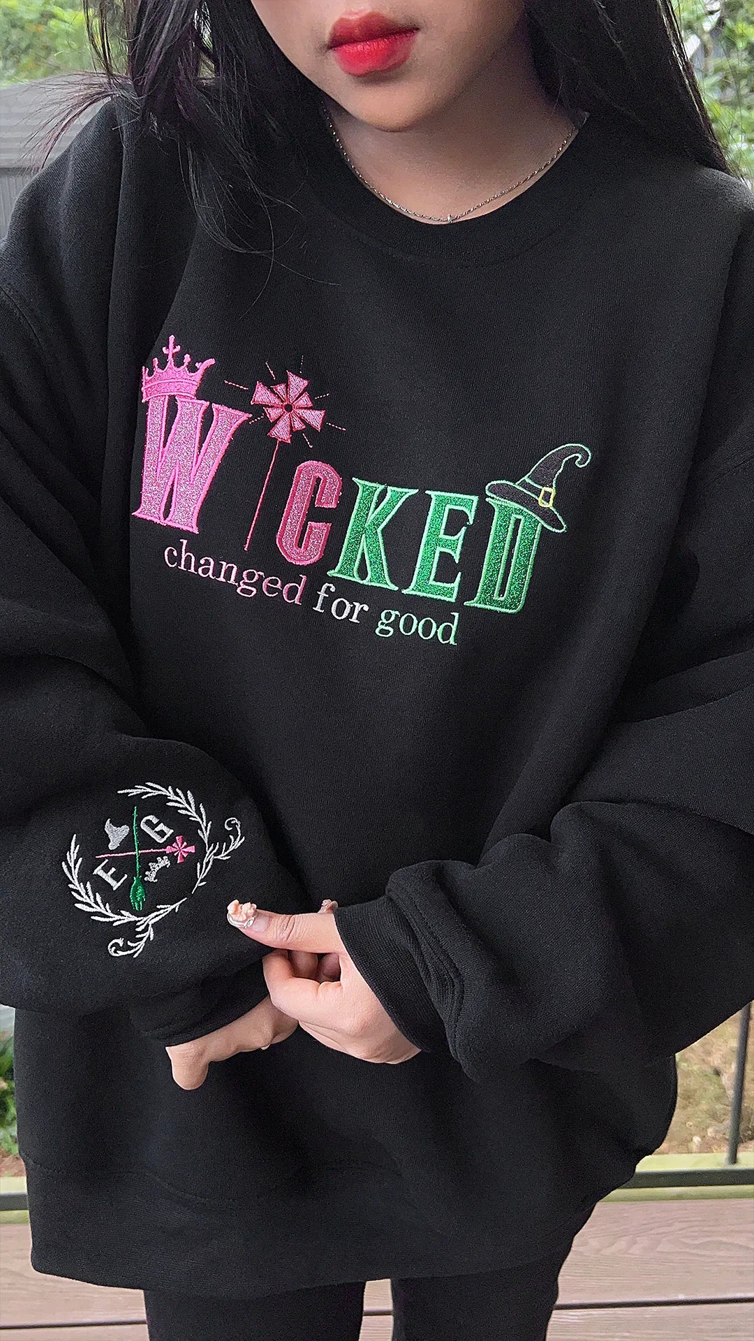 Embroidered Wicked sweatshirt with Elphaba and Glinda inspired design