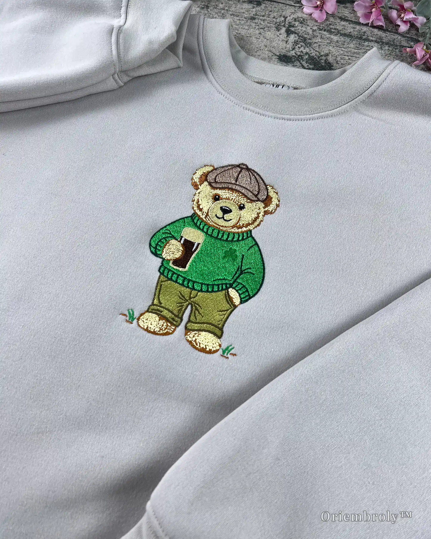 emerald green embroidered bear with cable knit sweater