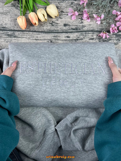 Gray unisex esthetician sweater for beauty professionals