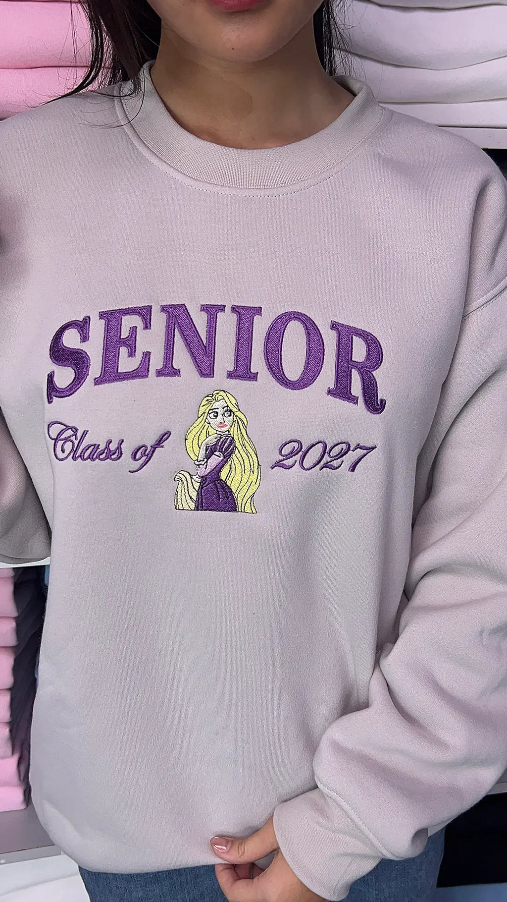 Fairytale-inspired embroidered graduation sweatshirt
